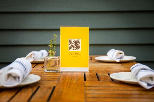 Restaurant table tents featuring a qr code