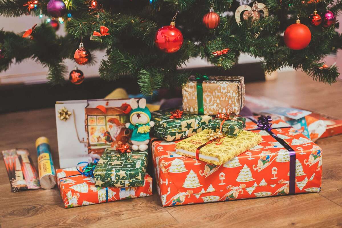 Personalized holiday gifts wrapped under the tree